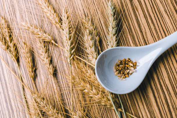 wheat on the wooden background - Fotografie, Obrázek