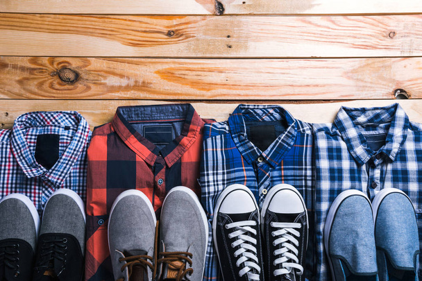 shirts plaid in plan with wooden background - 写真・画像