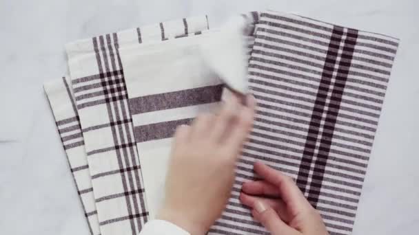 Folding Blck and white patterned paper towels on marble surface - Footage, Video