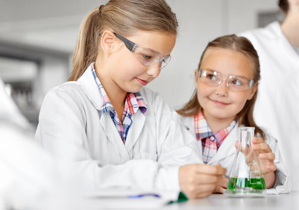 kids with test tube studying chemistry at school - Fotografie, Obrázek