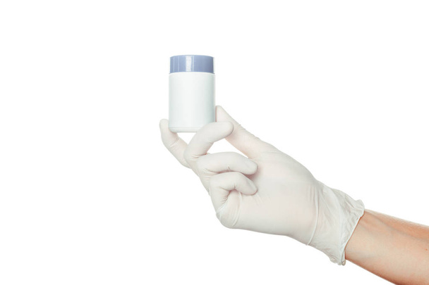 doctor's hand in white sterilized surgical glove holding medicine - Fotoğraf, Görsel