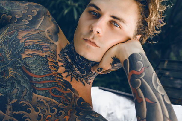 Portrait of handsome young man with tattoos  - Foto, Bild