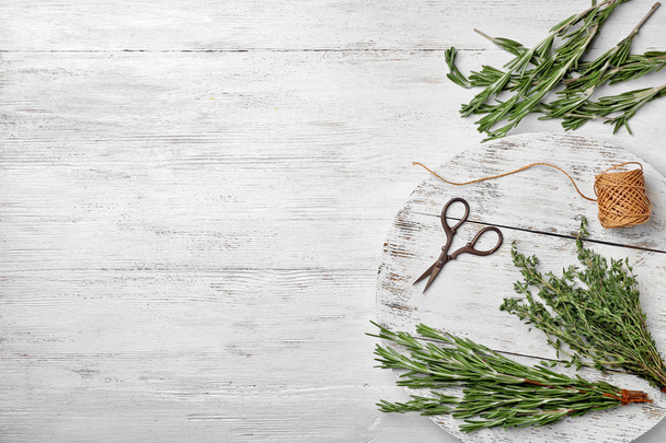 Flat lay composition with fresh green herbs on white wooden background - Foto, Imagem