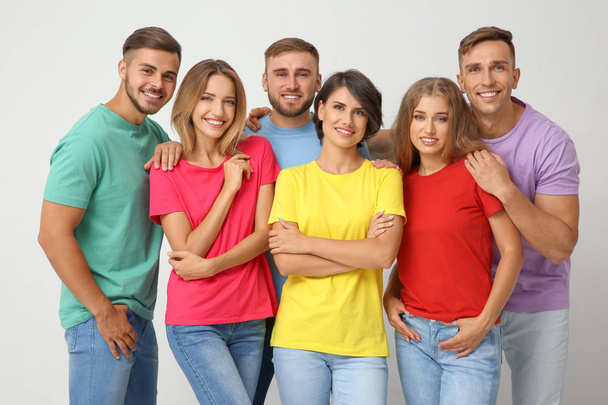 Group of young people on light background. Unity concept - Photo, image
