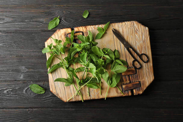 Fresh mint on wooden board, top view - Photo, Image