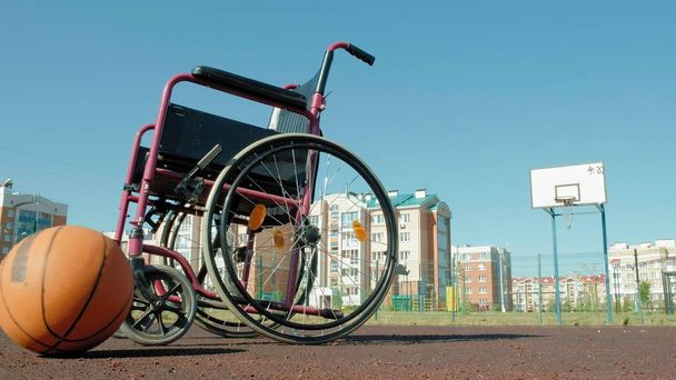 Type of wheelchair with a basket ball on a sports volleyball court - Fotoğraf, Görsel