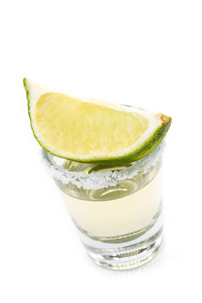 Mexican Gold tequila with lime and salt isolated on white background.  - Valokuva, kuva