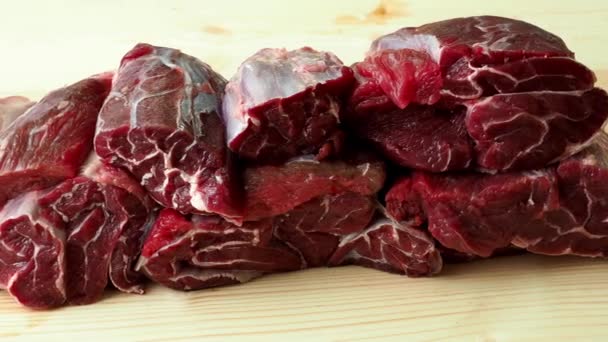 Raw breef meat on wooden table - Footage, Video