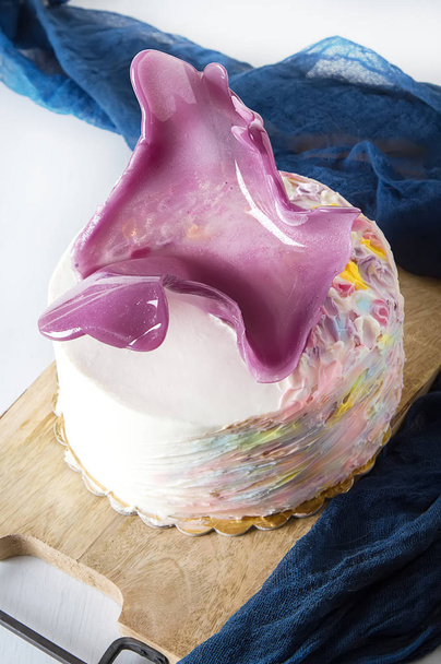 Birthday cake with pink caramel. White background - Photo, image