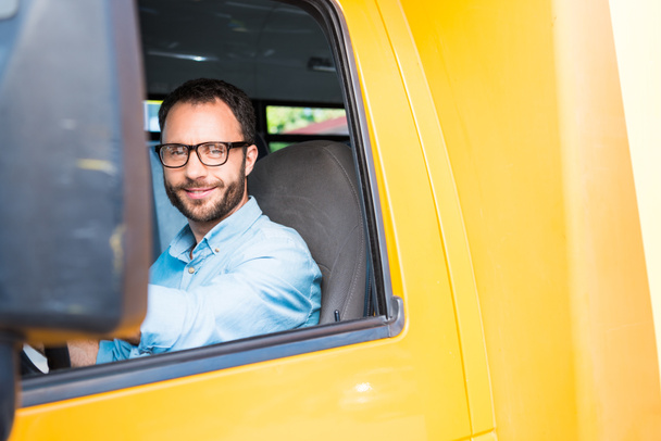 handsome happy school bus driver looking at camera - Photo, image