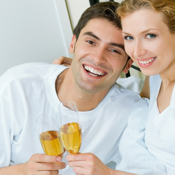 Cheerful couple with champagne - Valokuva, kuva
