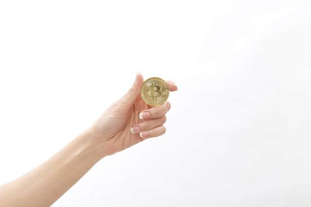 Cropped shot of woman holding bitcoin on white background, Financial Exchange Concepts - Φωτογραφία, εικόνα