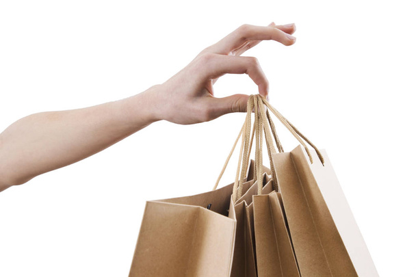 hands with shopping bags isolated in white - Fotoğraf, Görsel