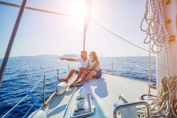 Young couple relaxing on the yacht - Фото, изображение