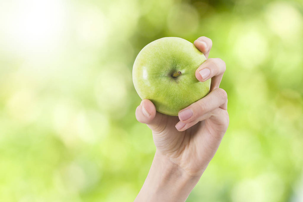 hands with natural green apple - Photo, Image