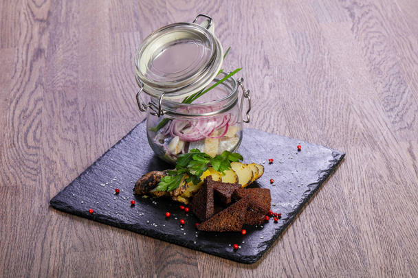Pickled herring with bread and onion - 写真・画像