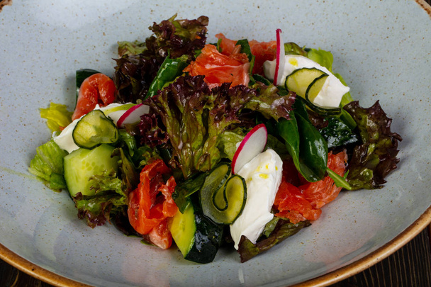 Salad with salmon and cream sauce - Фото, изображение