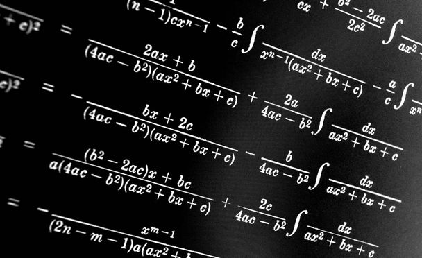 Large number of mathematical formulas on a black background - Photo, Image