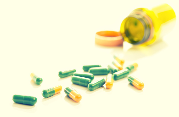 tablets capsules pills yellow green - Photo, Image
