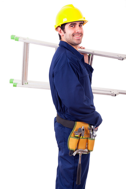 Portrait of a happy worker holding a ladder, isolated on white - Foto, immagini