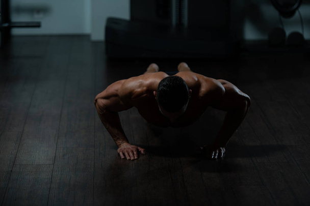 Athlete Doing Push-Up As Part Of Bodybuilding Training - Valokuva, kuva