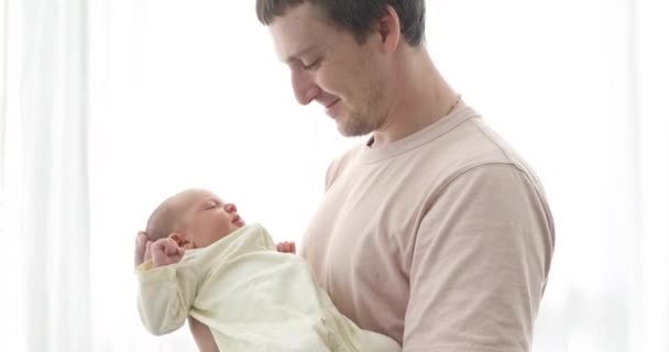 Father holding his newborn baby daughter - Footage, Video