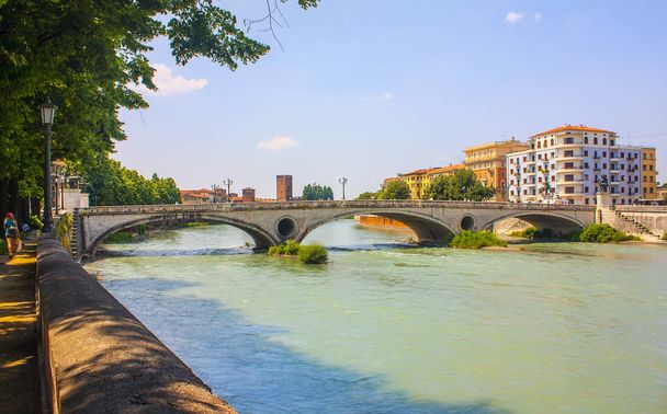 Verona, Italy - June 21, 2018: Bridge of Victory (Ponte della Vittoria) across Adige river in Verona - Photo, Image