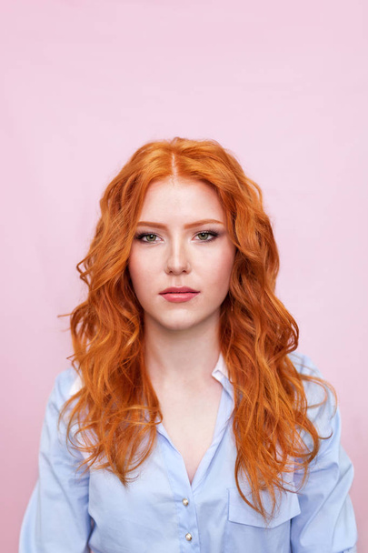 Portrait of beautiful red-haired girl on pink background. - Fotoğraf, Görsel