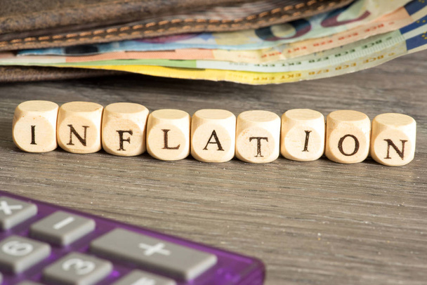 A wallet, Euro cash and the word inflation - Photo, Image