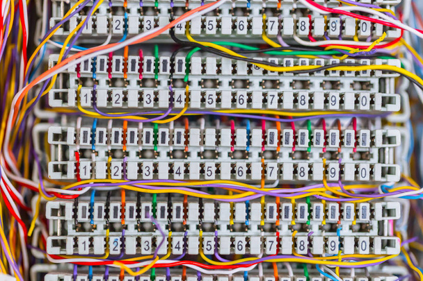 Complex massy managed colorful telephone cable lines in analog PBX box - Photo, Image