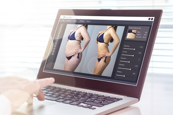 Professional man using laptop to transform chubby woman slim. Heavy photo editing with computer software. Standard of beauty, body image and post production concept. - Photo, Image
