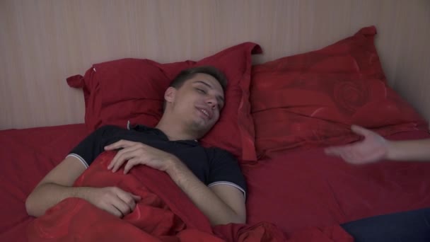 Young couple in bed in the bedroom - Imágenes, Vídeo