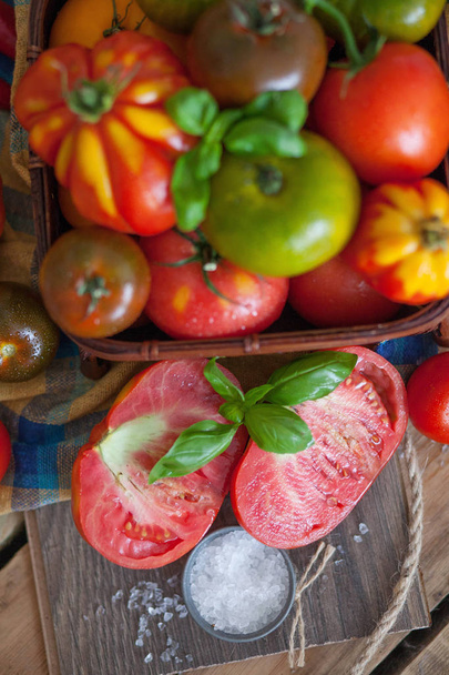 fresh basil and tomatoes on table - Fotó, kép