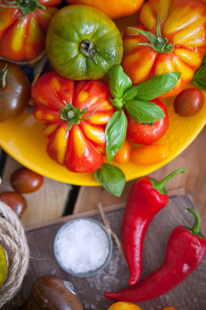fresh basil and tomatoes on table - 写真・画像