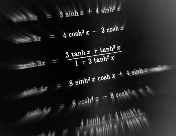 Large number of mathematical formulas focus zoom on a black background - Photo, Image