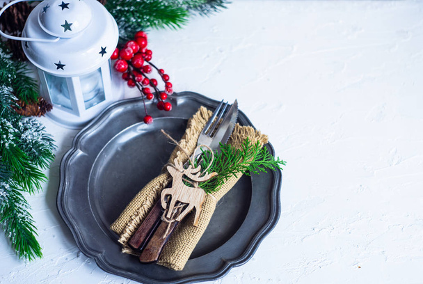 Christmas table setting on white background with copy space - Zdjęcie, obraz