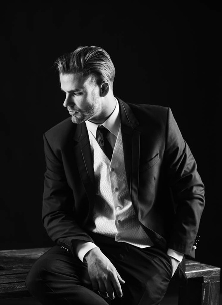 Serious man in classic suit or businessman on black background. - Foto, imagen