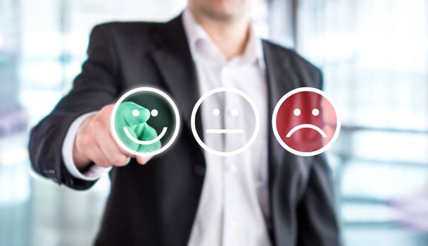 Business man giving rating and review with happy smiley face emoticon icon. Customer satisfaction and service or product quality survey or poll. Modern abstract feedback concept. - Photo, Image