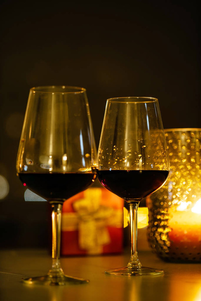 red wine and candles, close up - Фото, изображение