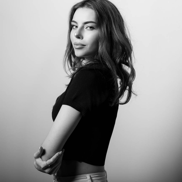 Young beautiful woman black-white studio portrait. - Foto, Bild