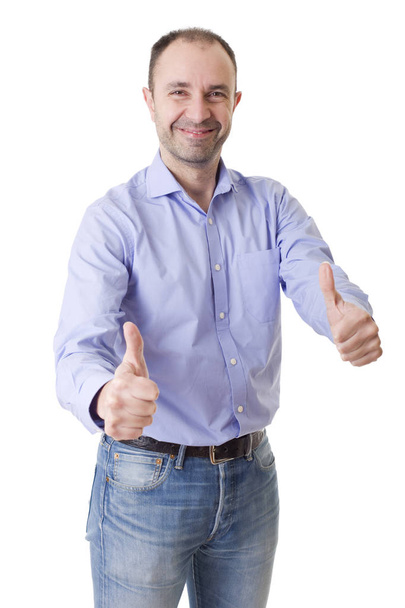 happy casual man going thumbs up, isolated on white background - Valokuva, kuva