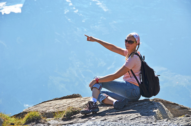 Traveler on the top of a rock. Switzerland - Fotó, kép