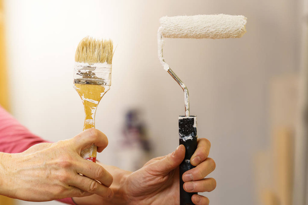 Home renovation, walls color change, diy concept. White paint with essentials equipment. - Фото, изображение