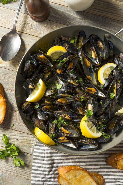 Homemade Steamed Mussels and Broth with Bread - Foto, Imagen