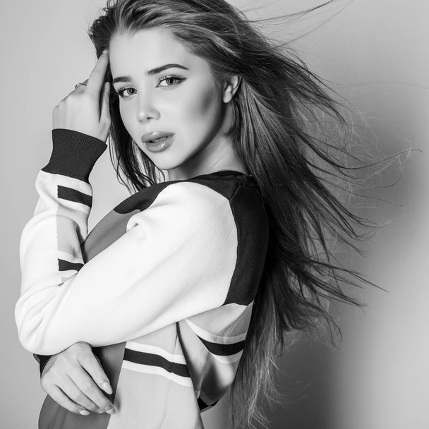 Young sensual model woman pose in studio. Black-white photo. - Фото, зображення