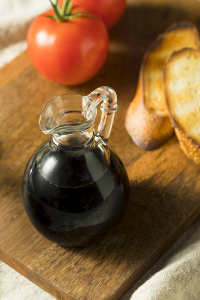 Organic Black Balsamic Vinegar in a Bottle - Фото, изображение