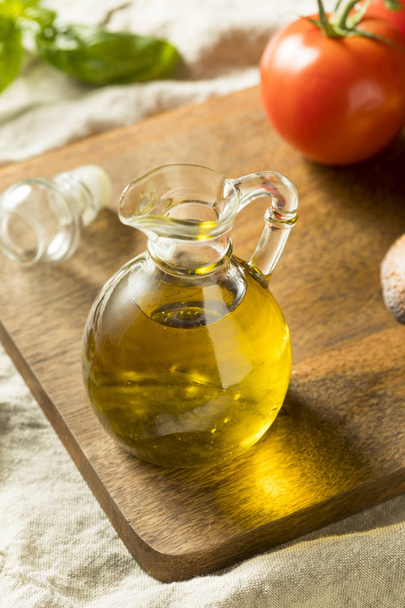Raw Organic Extra Virgin Olive OIl in a Bottle - Φωτογραφία, εικόνα