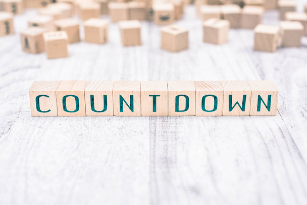 The Word Countdown Formed By Wooden Blocks On A White Table, Reminder Concept - Photo, Image