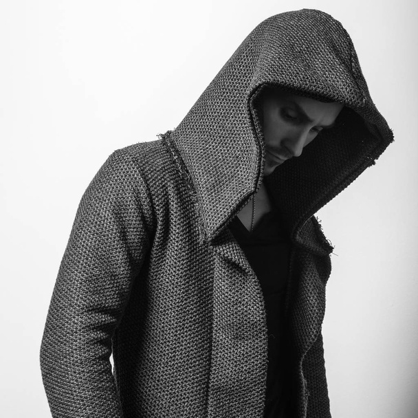 Handsome young man in hoodie pose. Black-white photo. - Photo, image