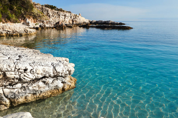 View of the rocky coast with clear turquoise water. Greece. Coastline of Corfu. - Photo, Image